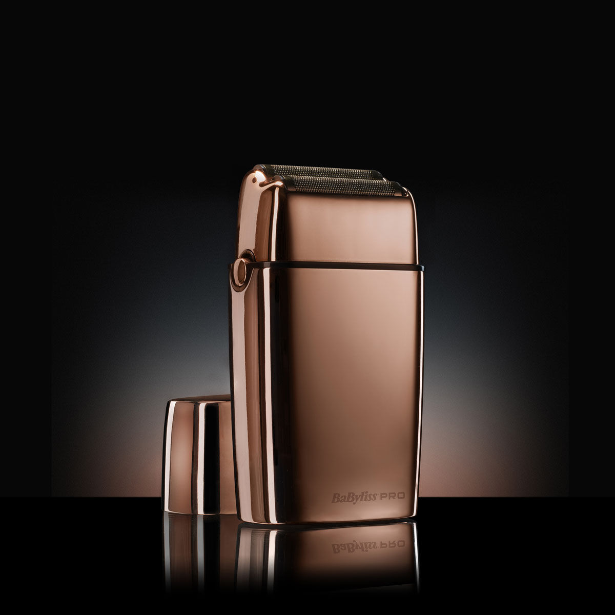Cordless Rose Gold Foil Shaver on dark background